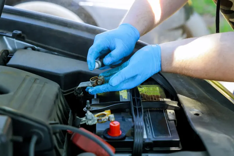 Mechanic replacing a car battery during a service at MVM Garage Bridlington