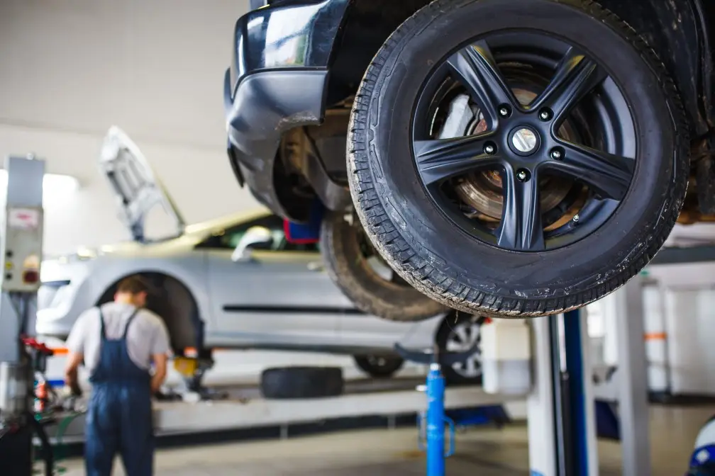 Car raised on a vehicle lift in the workshop at MVM Garage Bridlington