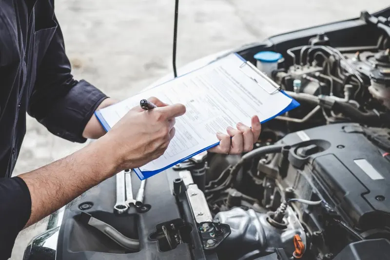 Mechanic inspecting a car engine during pre-MOT checks at MVM Garage Bridlington
